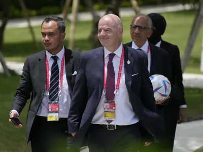 FIFA President Gianni Infantino, center, walks during the G20 Summit at the Nusa Dua, Bali, Indonesia on Tuesday, Nov. 15, 2022. (AP Photo/Achmad Ibrahim, Pool)