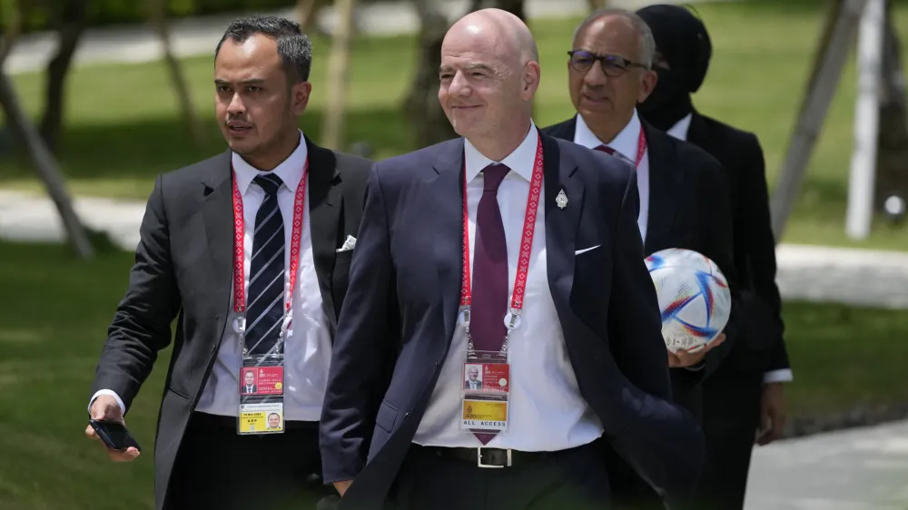 FIFA President Gianni Infantino, center, walks during the G20 Summit at the Nusa Dua, Bali, Indonesia on Tuesday, Nov. 15, 2022. (AP Photo/Achmad Ibrahim, Pool)