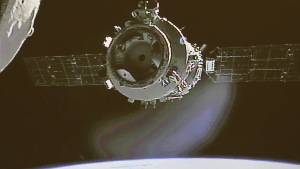 In this image made off the screen at the Beijing Aerospace Control Center in Beijing and released by China's Xinhua News Agency, Shenzhou-9 manned spacecraft parts from the orbiting Tiangong-1 space lab, partly seen on left, to prepare for the country's first manual space docking Sunday, June 24, 2012. The Chinese spacecraft and the space lab were joined together by an automated docking on June 18. (AP Photo/Beijing Aerospace Control Center via Xinhua) NO SALES