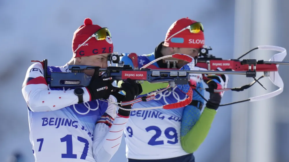 Jakub Stvrtecky of the Czech Republics (17) and Jakov Fak of Slovenia shoot during the men's 20-kilometer individual race at the 2022 Winter Olympics, Tuesday, Feb. 8, 2022, in Zhangjiakou, China. (AP Photo/Kirsty Wigglesworth)