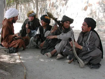 Talibans fighters sit outside the American embassy before it was raided<br>by thousands of angry demonstrators in Kabul on September 26, 2001.<br>Demonstrators set fire to part of the embassy compound in protest<br>agaainst Washington's threat to attack the ruling Taliban for its<br>continued harbouring of Saudi dissident, Osama bin Laden REUTERS/Sayed<br>Salahuddin<br><br>SS/CRB