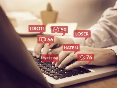 cyber bullying concept. people using notebook computer laptop for social media interactions with notification icons of hate speech and mean comment in social network