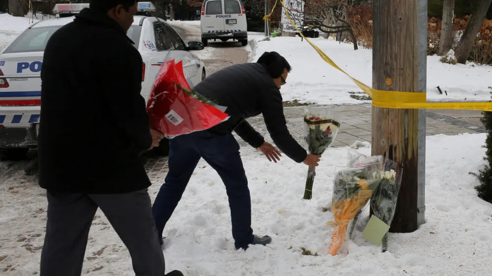 FILE PHOTO: Mourners place flowers outside the home of billionaire founder of Canadian pharmaceutical firm Apotex Inc., Barry Sherman and his wife Honey, who were found dead under circumstances that police described as "suspicious", in Toronto, Ontario, Canada, December 17, 2017. REUTERS/Chris Helgren/File Photo