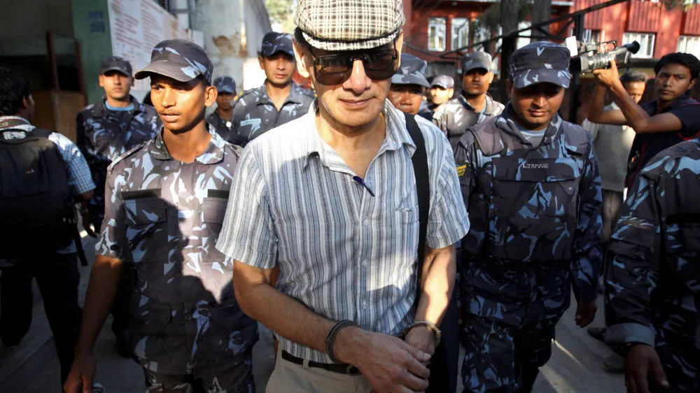 FILE PHOTO: French serial killer Charles Sobhraj leaves Kathmandu district court after his hearing in Kathmandu May 31, 2011. REUTERS/Navesh Chitrakar/File Photo