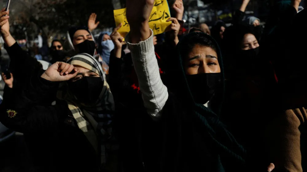 Afghan women chant slogans in protest against the closure of universities to women by the Taliban in Kabul, Afghanistan, December 22, 2022. REUTERS/Stringer