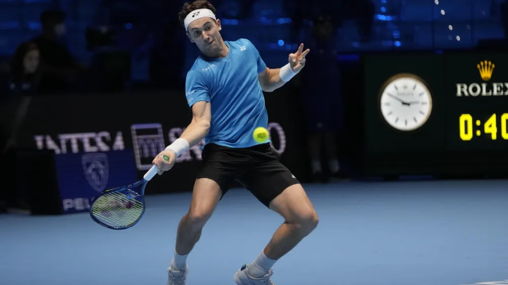 Norways' Casper Ruud returns the ball to Russia's Andrey Rublev during their ATP World Tour Finals singles tennis match, at the Pala Alpitour in Turin, Friday, Nov. 19, 2021. (AP Photo/Luca Bruno)