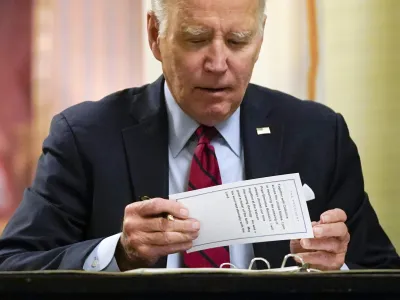 President Joe Biden puts a notecard away after signing a condolence book at the Apostolic Nunciature of the Holy See in Washington, Thursday, Jan. 5, 2023, for Pope Emeritus Benedict XVI. Benedict died at 95 on Dec. 31, 2022, in the monastery on the Vatican grounds where he had spent nearly all of his decade in retirement. (AP Photo/Patrick Semansky)