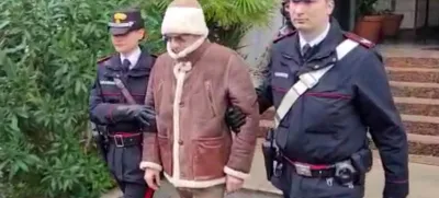 A screengrab taken from a video shows Matteo Messina Denaro the country's most wanted mafia boss being escorted out of a Carabinieri police station after he was arrested in Palermo, Italy, January 16, 2023. Carabinieri/Handout via REUTERS ATTENTION EDITORS THIS IMAGE HAS BEEN SUPPLIED BY A THIRD PARTY.