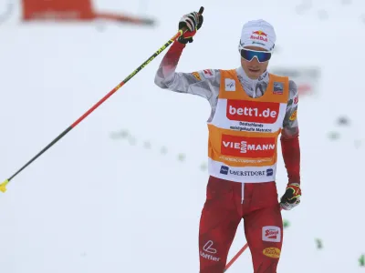 04 February 2023, Bavaria, Oberstdorf: Austrian nordic combined skier Johannes Lamparter crosses the finish line of the men's individual large hill/10 km of the FIS Nordic Combined World Cup in Oberstdorf. Photo: Karl-Josef Hildenbrand/dpa