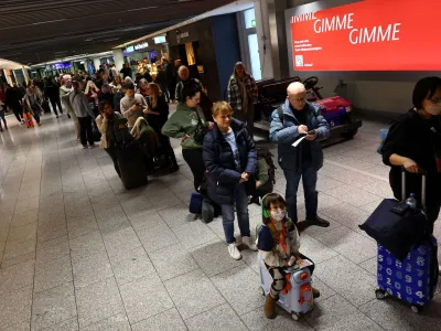 Passengers stand in line after an IT fault at Germany?s Lufthansa causes massive flight delays and disruptions in Frankfurt, Germany, February 15, 2023.   REUTERS/Kai Pfaffenbach