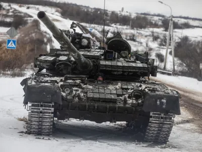 A Ukrainian serviceman drives a tank along a road outside the frontline town of Bakhmut, amid Russia's attack on Ukraine, in Donetsk region, Ukraine February 14, 2023. REUTERS/Yevhenii Zavhorodnii