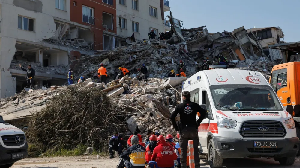 Rescuers work at the site of a collapsed building, in the aftermath of the deadly earthquake, in Antakya, Turkey February 18, 2023. REUTERS/Maxim Shemetov