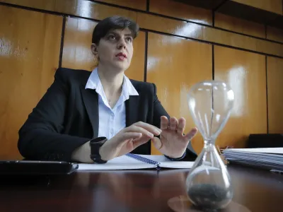 In this photo taken on Friday, Oct. 4, 2019, Laura Codruta Kovesi, Romania's former chief anti-corruption prosecutor who will direct the European Public Prosecutor's Office (EPPO) - tasked with investigating fraud connected to the use of EU funds and other financial crimes, speaks during an interview with the Associated Press, in Bucharest, Romania. For Kovesi, opposition to her successful candidacy to become the European Union&acirc;&euro;&trade;s first chief prosecutor came from a familiar source - her own country&acirc;&euro;&trade;s government. Kovesi spent five years as head of the Romanian Anticorruption Directorate and those indicted by her office included 14 Cabinet members, 53 lawmakers and a member of the European Parliament. (AP Photo/Vadim Ghirda)