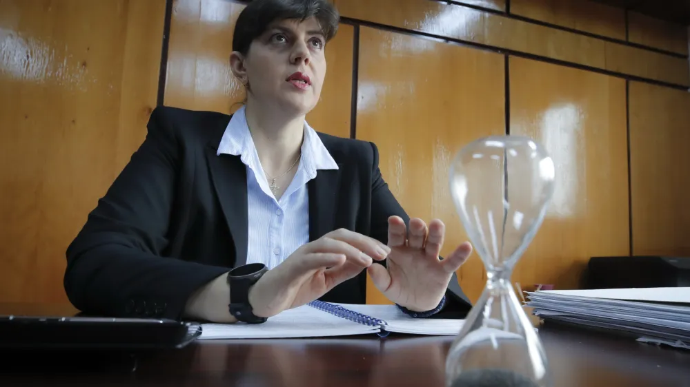 In this photo taken on Friday, Oct. 4, 2019, Laura Codruta Kovesi, Romania's former chief anti-corruption prosecutor who will direct the European Public Prosecutor's Office (EPPO) - tasked with investigating fraud connected to the use of EU funds and other financial crimes, speaks during an interview with the Associated Press, in Bucharest, Romania. For Kovesi, opposition to her successful candidacy to become the European Union&acirc;&euro;&trade;s first chief prosecutor came from a familiar source - her own country&acirc;&euro;&trade;s government. Kovesi spent five years as head of the Romanian Anticorruption Directorate and those indicted by her office included 14 Cabinet members, 53 lawmakers and a member of the European Parliament. (AP Photo/Vadim Ghirda)