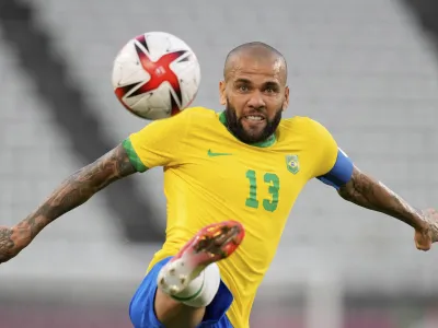 FILE - Brazil's Dani Alves kicks the ball during a men's soccer semifinal match at the 2020 Summer Olympics, Tuesday, Aug. 3, 2021, in Kashima, Japan. Brazilian soccer player Dani Alves has been arrested after being accused of sexually abusing a woman in Barcelona it was reported on Friday, Jan. 20, 2023. Police say the alleged act took place on Dec. 31 at a night club in Barcelona. (AP Photo/Andre Penner, File)