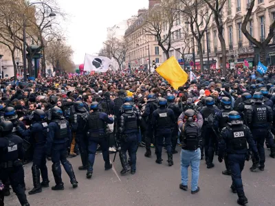 French riot police face off with protesters during a demonstration as part of the ninth day of nationwide strikes and protests against French government's pension reform, in Paris, France, March 23, 2023. REUTERS/Nacho Doce