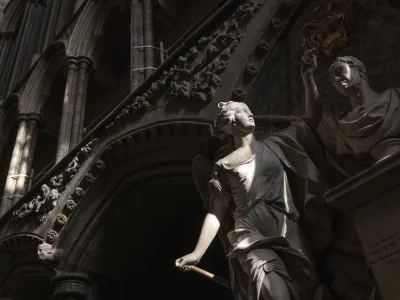 A statue is illuminated by the sun inside Westminster Abbey in London, Wednesday, April 12, 2023, ahead of the King's coronation. Westminster Abbey has been used as Britain's coronation church since William the Conqueror in 1066, with the exception of kings Edward V and Edward VIII, who were not crowned. King Charles III will be the 40th reigning monarch to be crowned there during a ceremony on May 6, 2023. (Dan Kitwood/Pool Photo via AP)