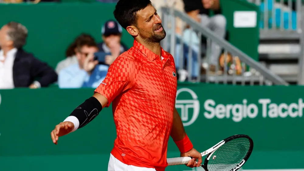 FILE PHOTO: Tennis - ATP Masters 1000 - Monte Carlo Masters - Monte-Carlo Country Club, Roquebrune-Cap-Martin, France - April 13, 2023 Serbia's Novak Djokovic reacts during his round of 16 match against Italy's Lorenzo Musetti REUTERS/Eric Gaillard/File Photo