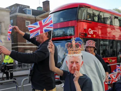 Well-wishers gather along the path that Britain's King Charles and Queen Consort Camilla will travel during the procession marking their coronation along the main streets of London, Britain, May 5, 2023. REUTERS/Violeta Santos Moura