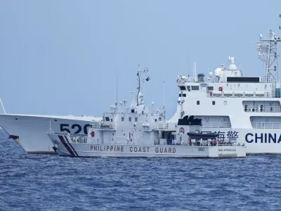 A Chinese Coast Guard ship with bow number 5201 blocks Philippine Coast Guard ship BRP Malapascua as it maneuvers to enter the mouth of the Second Thomas Shoal locally known as Ayungin Shoal at the South China Sea on Sunday, April 23, 2023. The near-collision was among the tense confrontations encountered by two Philippine government vessels against China, which undertook a weeklong voyage in one of the world's most hotly contested sea passages to assert Philippine sovereignty. (AP Photo/Aaron Favila)