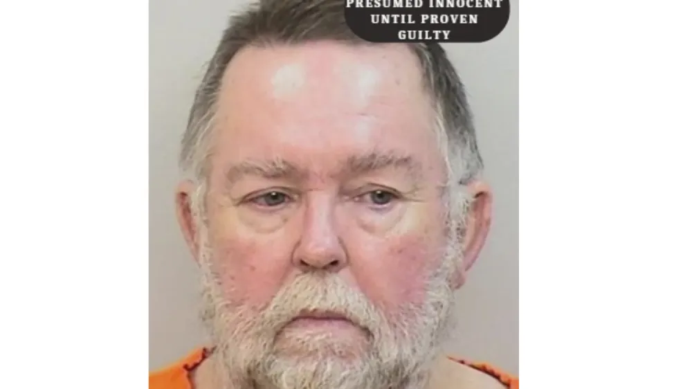 This booking photo provided by Calcasieu Parish Sheriff's Office shows David Doyle. Doyle has been charged with aggravated assault and battery after shooting at children who had been playing hide and seek outside his home, on Sunday, May 7, 2023 in Starks, La., striking a 14-year-old girl, officials said. (Calcasieu Parish Sheriff's Office via AP)
