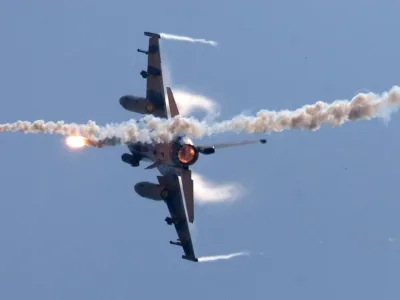 FILE - In this July 20, 2006 file photo, a U.S.-made F-16 fighter jet launches flares as he rolls on the side during the the annual Han Kuang No. 22 exercises, off Ilan, 80 kilometers, 49 miles, west of Taipei, Taiwan. China denounced a decision by the United States to upgrade Taiwan's F-16 fighter jets, summoning the U.S. ambassador and warning that military ties and overall relations will suffer, on Thursday, Sept. 22, 2011. (AP Photo, File)