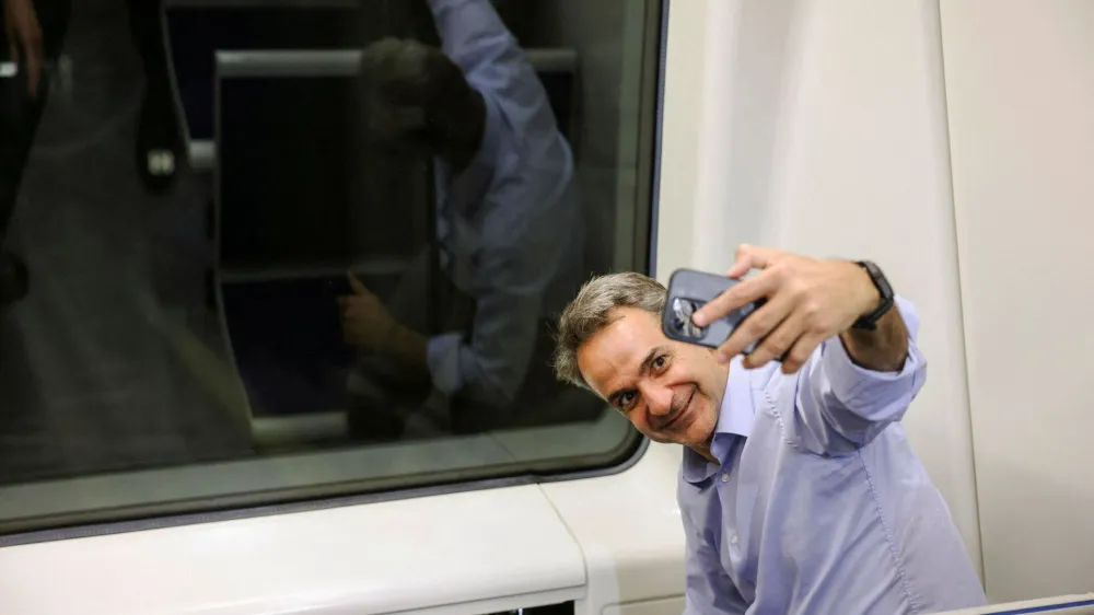 Greek Prime Minister Kyriakos Mitsotakis takes a selfie at the cockpit of a train as he visits Thessaloniki subway during its first trial run with passengers in Thessaloniki, Greece, May 18, 2023. REUTERS/Alexandros Avramidis/Pool   TPX IMAGES OF THE DAY