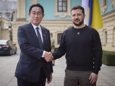 FILE - Japanese Prime Minister Fumio Kishida, left, and Ukrainian President Volodymyr Zelenskyy, right, greet each other during their meeting in Kyiv, Ukraine, March 21, 2023. President Zelenskyy will join leaders of the world's most powerful democracies in Hiroshima, Japan, making his furthest trip from of his war-torn country as leaders are set to unveil new sanctions on Russia for its invasion.(Ukrainian Presidential Press Office via AP, File)