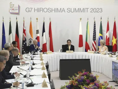 U.S. President Joe Biden, center left, Japanese Prime Minister Fumio Kishida, center, European Commission President Ursula von der Leyen, right, attend an event on global infrastructure and investment during the G7 Summit in Hiroshima, Japan, Saturday, May 20, 2023. (Japan Pool via AP)
