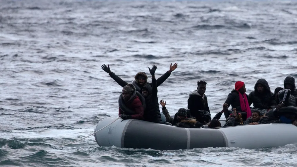 FILE PHOTO: Migrants from sub-saharan African countries on a dinghy react as they are towed by a rescue boat during their effort to cross part of the Aegean Sea from Turkey to the island of Lesbos, Greece, February 29, 2020. REUTERS/Alkis Konstantinidis/File Photo