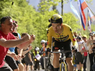 Fans cheer on Slovenia's Primoz Roglic during the 20th stage of the Giro d'Italia cycling race, an individual mountain time trial from Tarvisio to Monte Lussari, Italy, Saturday, May 27, 2023. (Fabio Ferrari/LaPresse via AP)