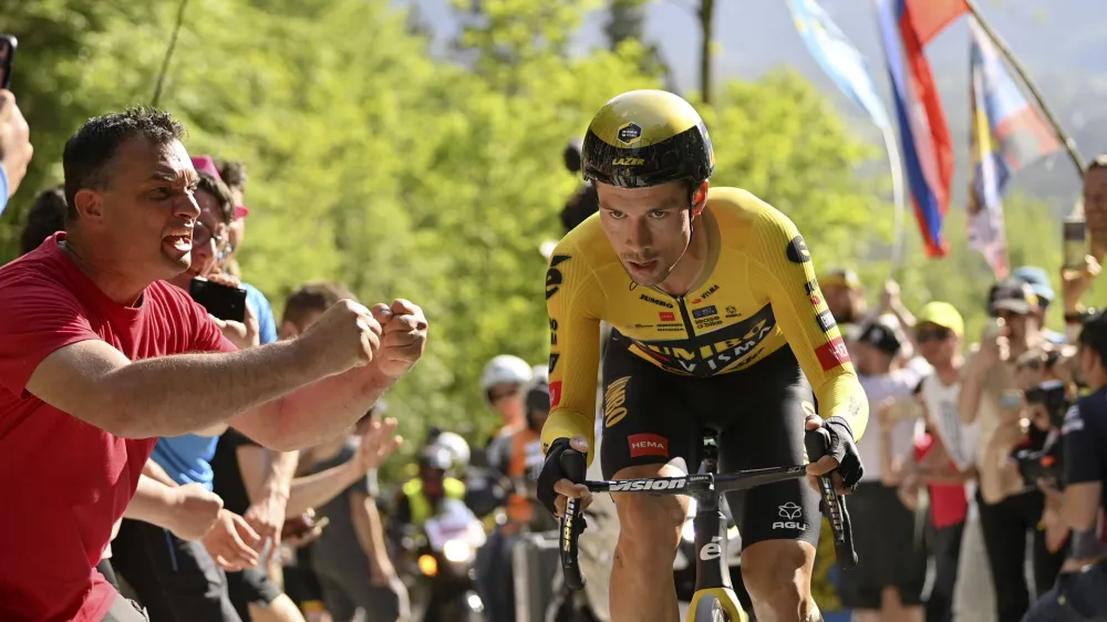 Fans cheer on Slovenia's Primoz Roglic during the 20th stage of the Giro d'Italia cycling race, an individual mountain time trial from Tarvisio to Monte Lussari, Italy, Saturday, May 27, 2023. (Fabio Ferrari/LaPresse via AP)