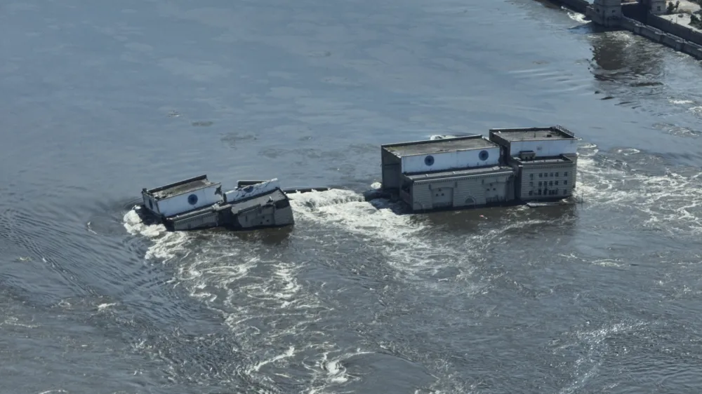 Water flows over the collapsed Kakhovka Dam in Nova Kakhovka, Ukraine, Wednesday, June 7, 2023. (AP Photo)