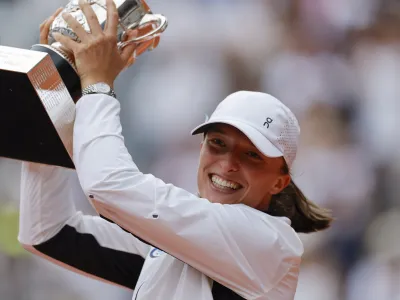 Poland's Iga Swiatek celebrates winning the women's final match of the French Open tennis tournament against Karolina Muchova of the Czech Republic in three sets, 6-2, 5-7, 6-4, at the Roland Garros stadium in Paris, Saturday, June 10, 2023. (AP Photo/Jean-Francois Badias)