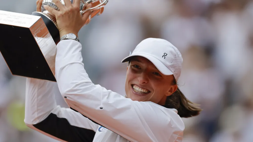 Poland's Iga Swiatek celebrates winning the women's final match of the French Open tennis tournament against Karolina Muchova of the Czech Republic in three sets, 6-2, 5-7, 6-4, at the Roland Garros stadium in Paris, Saturday, June 10, 2023. (AP Photo/Jean-Francois Badias)