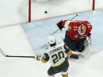 Vegas Golden Knights center Chandler Stephenson (20) scores goal past Florida Panthers goaltender Sergei Bobrovsky (72) during the first period in Game 4 of the NHL hockey Stanley Cup Finals, Saturday, June 10, 2023, in Sunrise, Fla. (AP Photo/Lynne Sladky)