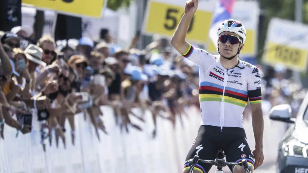 Remco Evenepoel from Belgium of Soudal-Quick Step crosses the finish line as winner of the seventh stage, a 174 km race from Tuebach to Weinfelden, at the 86th Tour de Suisse UCI World Tour cycling race, in Weinfelden, Switzerland, Saturday, June 17, 2023. (Gian Ehrenzeller/Keystone via AP)