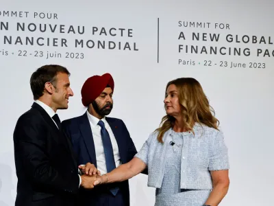 French President Emmanuel Macron, World Bank President Ajay Banga and U.S. philanthropist Melinda French Gates take part in a round table to discuss the global economy during the New Global Financial Pact Summit at the Palais Brongniart in Paris, France on June 22, 2023.   LUDOVIC MARIN/Pool via REUTERS