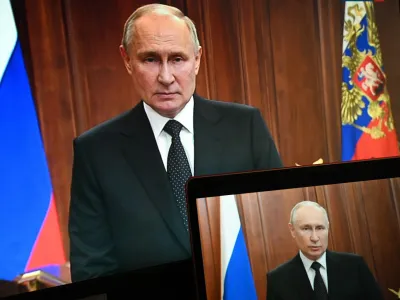 FILE - Russian President Vladimir Putin is seen on monitors as he addresses the nation after Yevgeny Prigozhin, the owner of the Wagner Group military company, called for armed rebellion and reached the southern city of Rostov-on-Don with his troops, in Moscow, Russia, Saturday, June 24, 2023. (Pavel Bednyakov, Sputnik, Kremlin Pool Photo via AP, File)