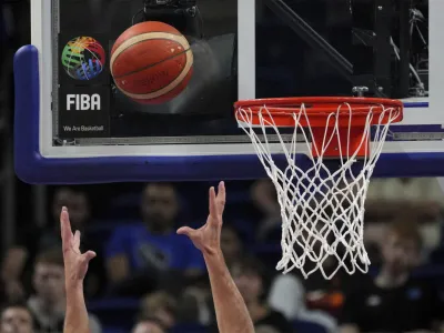 Belgium's Maxime De Zeeuw catches the ball during the Eurobasket round of sixteen basketball match between Slovenia and Belgium in Berlin, Germany, Saturday, Sept. 10, 2022. (AP Photo/Michael Sohn)