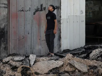 05 July 2023, Palestinian Territories, Jenin: A Palestinian child inspects damages at the Jenin refugee camp after the large-scale Israeli military operation in the West Bank town of Jenin. 12 Palestinians were killed and more than 120 wounded. Photo: Ayman Nobani/dpa