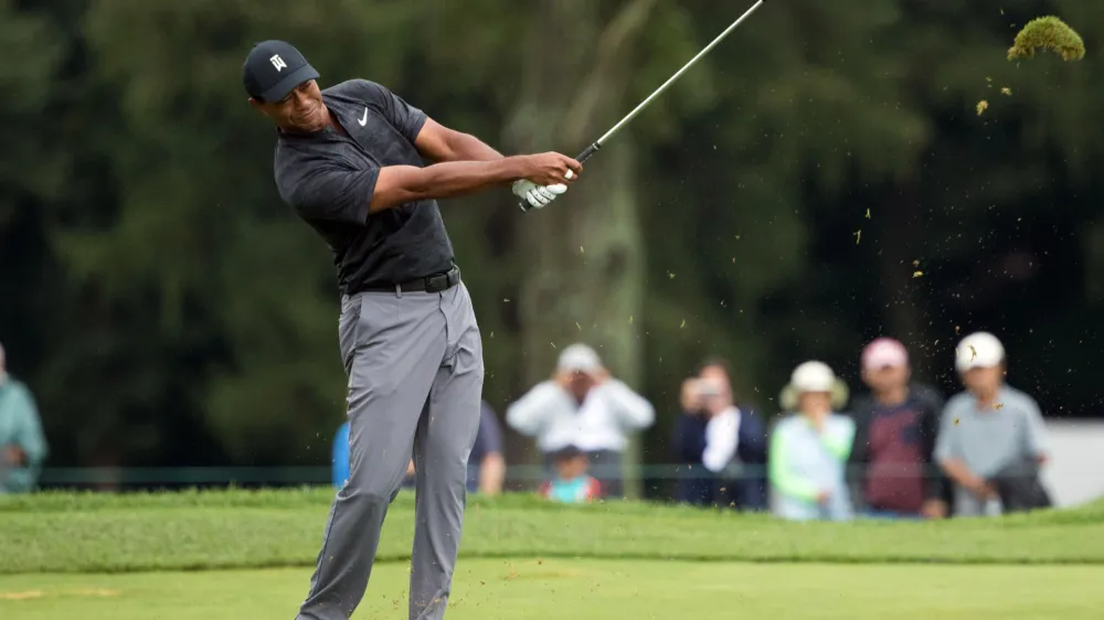 Sep 8, 2018; Newtown Square, PA, USA; Tiger Woods hits his approach shot on the 3rd hole during the third round of the BMW Championship golf tournament at Aronimink GC. Mandatory Credit: Bill Streicher-USA TODAY Sports