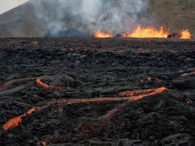 FILE PHOTO: Iceland's Fagradalsfjall volcano sputters lava from the uninhabited Meradalir Valley on the Reykjanes peninsula, about 20 miles from Reykjavik, Iceland August 5, 2022. REUTERS/Ken Cedeno/File Photo