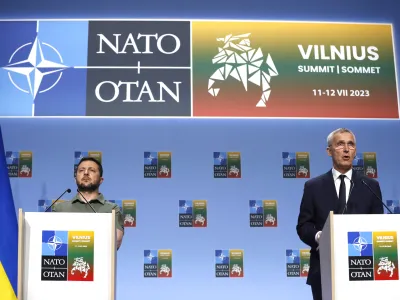 NATO Secretary General Jens Stoltenberg, right, and Ukraine's President Volodymyr Zelenskyy address a media conference during a NATO summit in Vilnius, Lithuania, Wednesday, July 12, 2023. NATO leaders gathered Wednesday to launch a highly symbolic new forum for ties with Ukraine, after committing to provide the country with more military assistance for fighting Russia but only vague assurances of future membership. (AP Photo/Mindaugas Kulbis)
