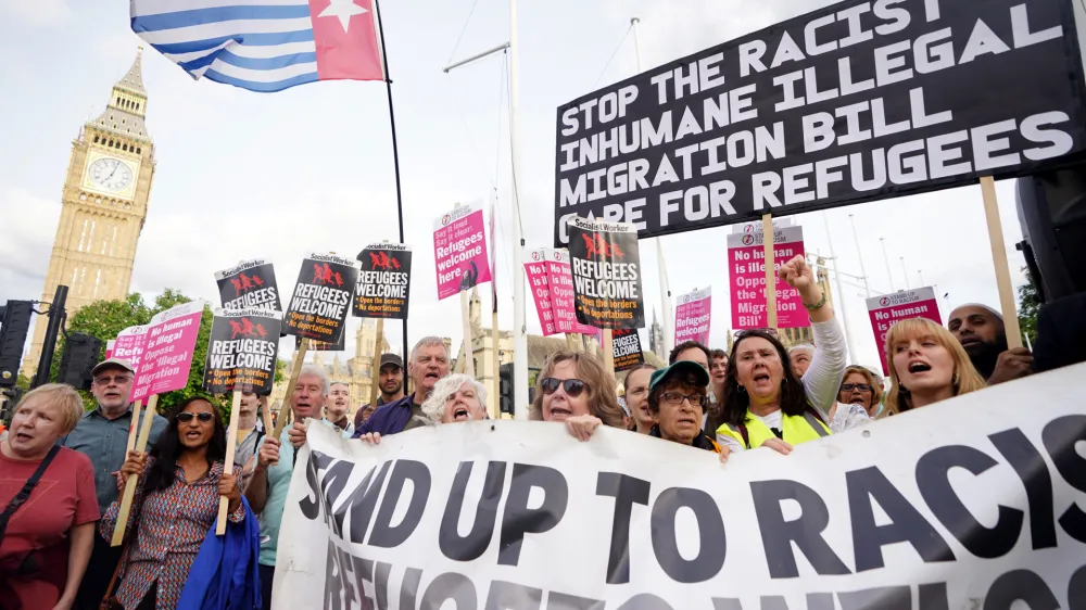 17 July 2023, United Kingdom, London: Demonstrators take part in a protest against the Illegal Migration Bill in Parliament Square, Westminster, as the bill proceeds through Parliament. Photo: James Manning/PA Wire/dpa
