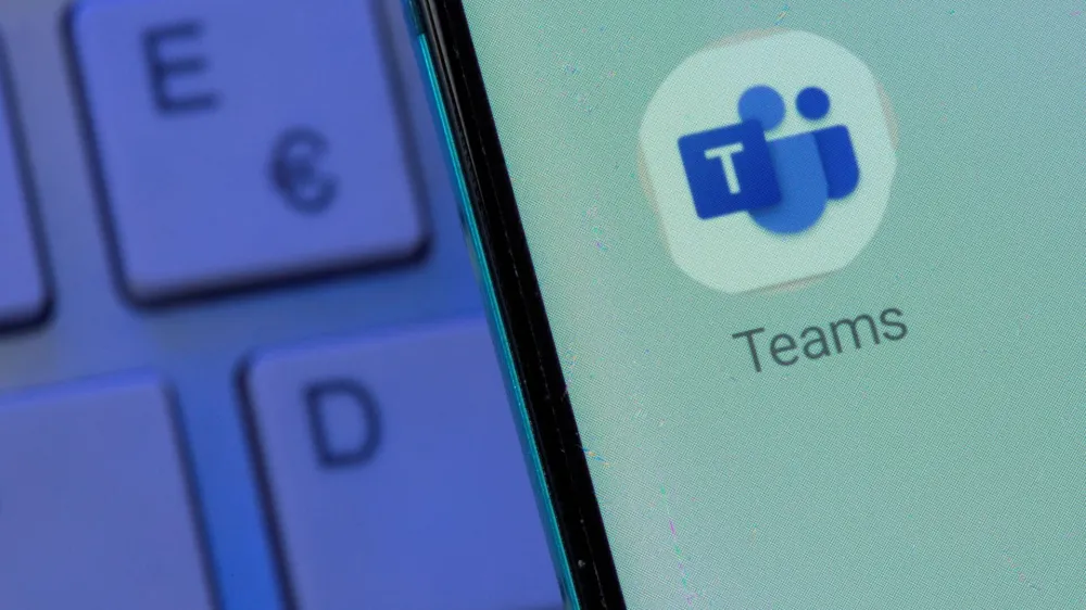 FILE PHOTO: Microsoft Teams app is seen on the smartphone placed on the keyboard in this illustration taken, July 26, 2021. REUTERS/Dado Ruvic/File Photo