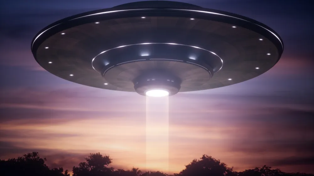 3D illustration. Spacecraft alien floating over the trees with tractor beam.