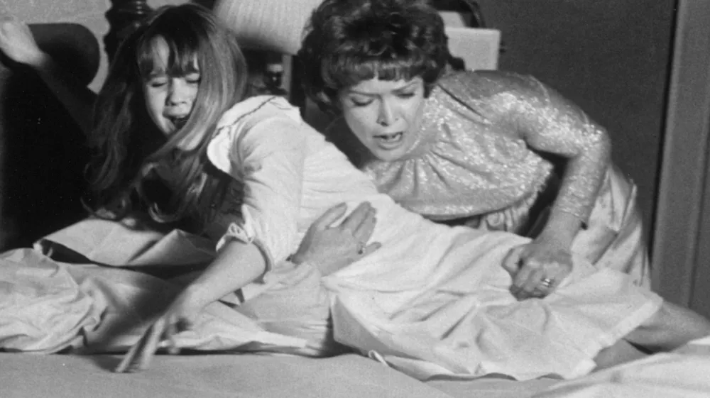 Linda Blair and Ellen Burstyn in the movie the Exorcist