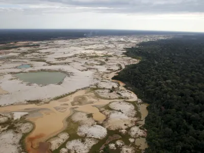 An area deforested by illegal gold mining is seen in a zone known as Mega 14, in the southern Amazon region of Madre de Dios July 13, 2015. Peruvian police razed dozens of illegal gold mining camps at the edge of an Amazonian nature reserve this week, part of a renewed bid to halt the spread of wildcatting in a remote rainforest region. The stings at the edge of the Tambopata National Reserve were the first in the southeastern region of Madre de Dios since a crackdown let up in December. Production from wildcat miners in Madre de Dios, who sell their ore up the supply chain, made up about 10 percent of national production before President Ollanta Humala launched the harshest crackdown yet on illegal gold mining last year. Picture taken July 13, 2015. REUTERS/Janine Costa   TPX IMAGES OF THE DAY   - GF10000160494