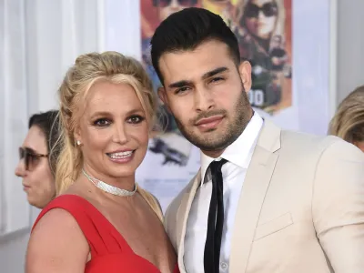 FILE - Britney Spears and Sam Asghari appear at the Los Angeles premiere of "Once Upon a Time in Hollywood" on July 22, 2019. Asghari has filed for divorce from Spears, a person familiar with the filing said late Wednesday, Aug. 16, 2023. The person, who is close to Asghari but not authorized to speak publicly, confirmed the filing happened Wednesday, hours after several outlets including TMZ and People magazine reported the couple had separated. (Photo by Jordan Strauss/Invision/AP, File)